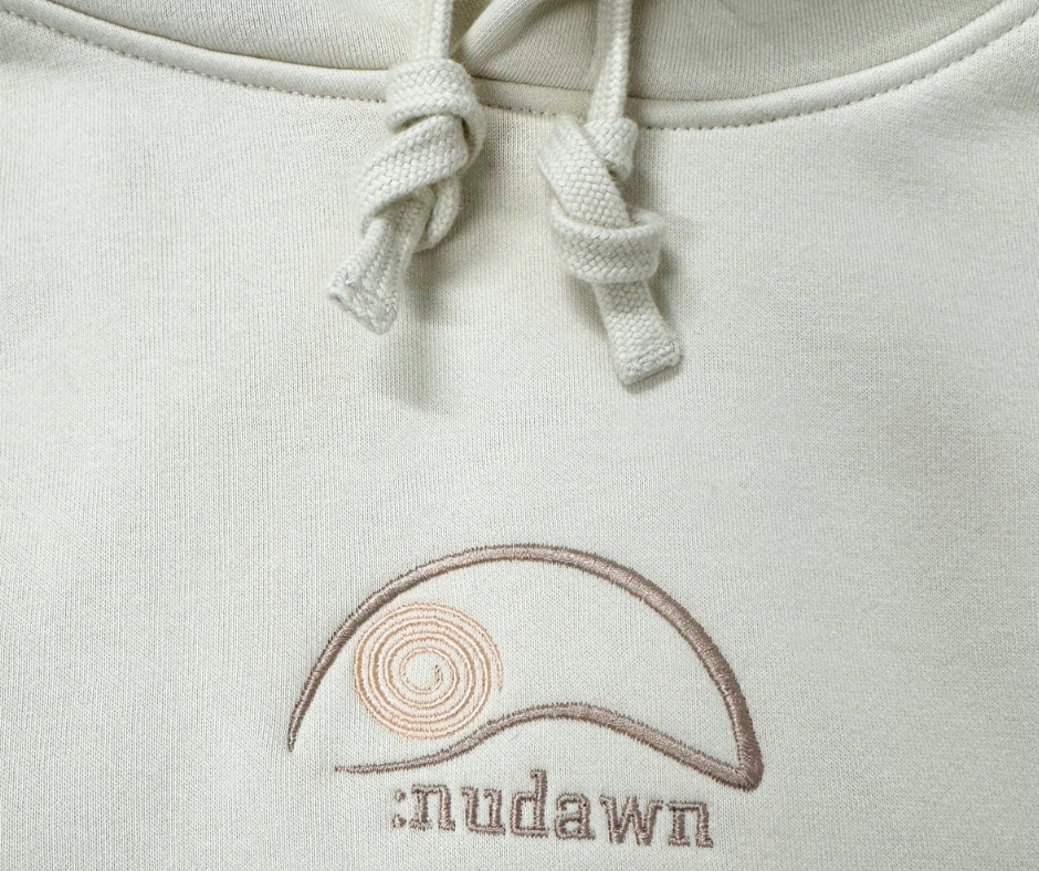 White Womens Christian Hoodie with :nudawn logo on front and Kingdom embroidered on the back. Referring to the kingdom of Christ. Christian apparel and followers of the way. 